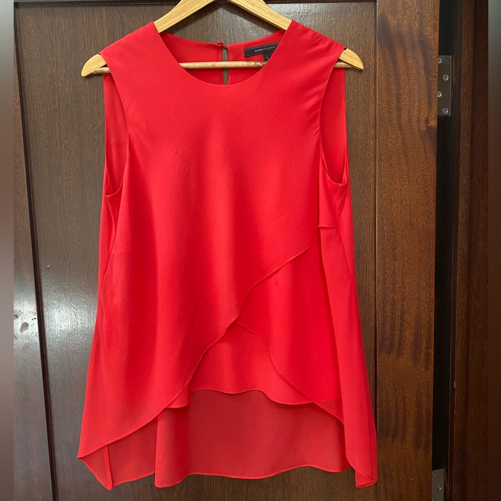 BCBG MAX AZRIA red sleeveless draped top.
